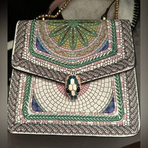 Brand new. Pink and green patterned bag with gold chain and snake head.
